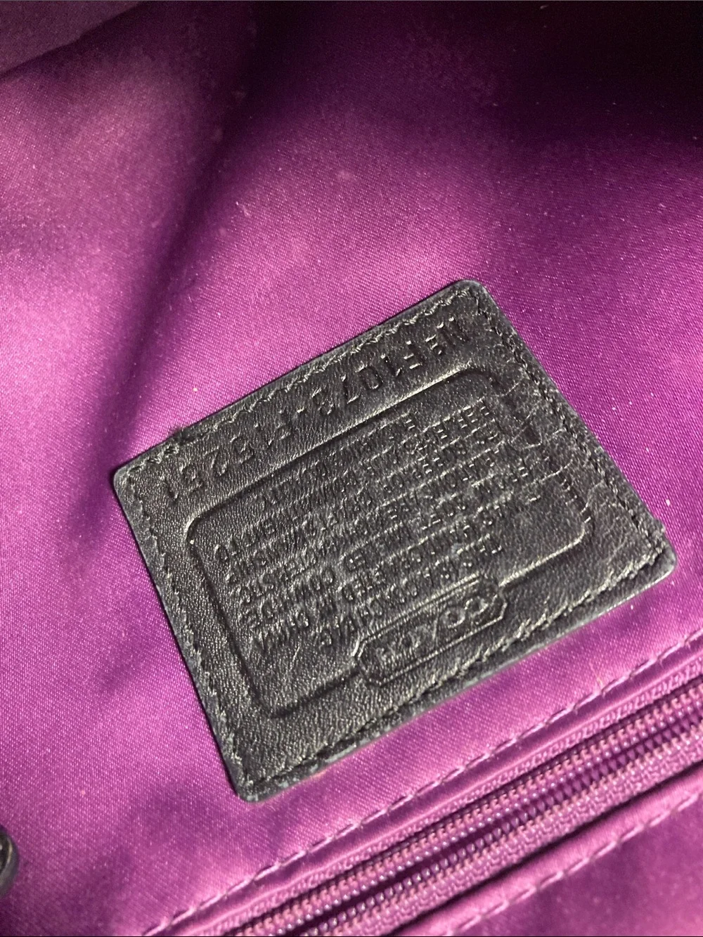 Coach black pebbled leather Carly hobo shoulder bag with silver hardware.